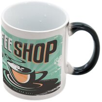 Taza negra con grabado que se revela con calor